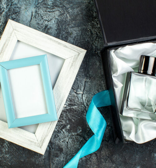 top-view-of-blue-ribbon-on-man-perfume-in-a-gift-b-2021-08-30-18-56-22-utc